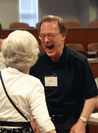 a man laughing at a woman