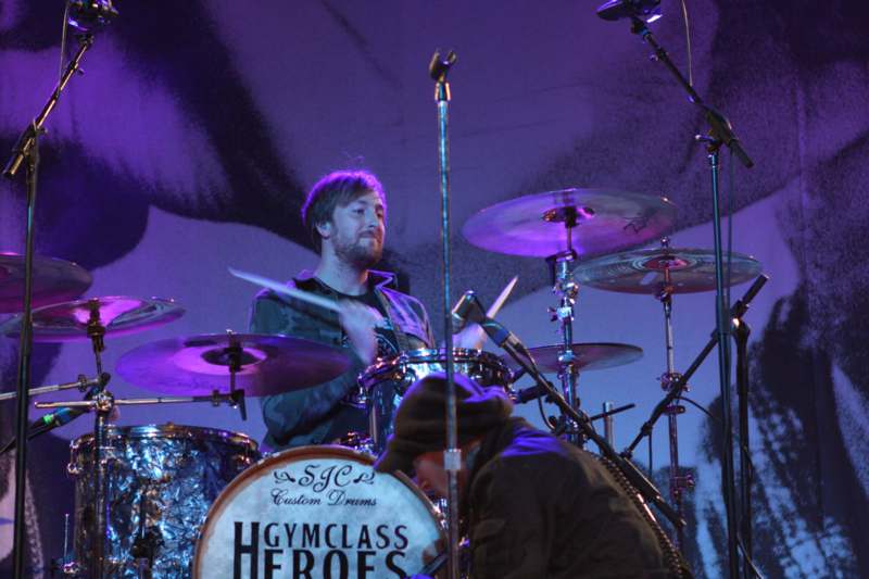 a man playing a drum set
