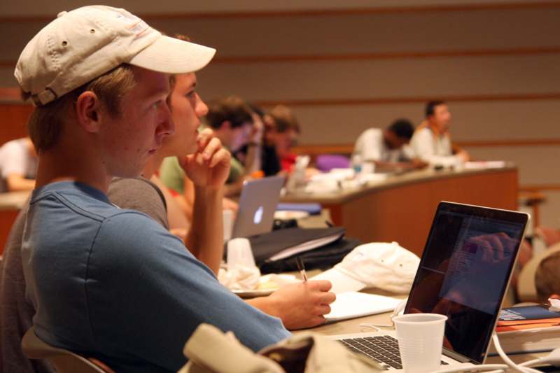 a group of people in a lecture hall