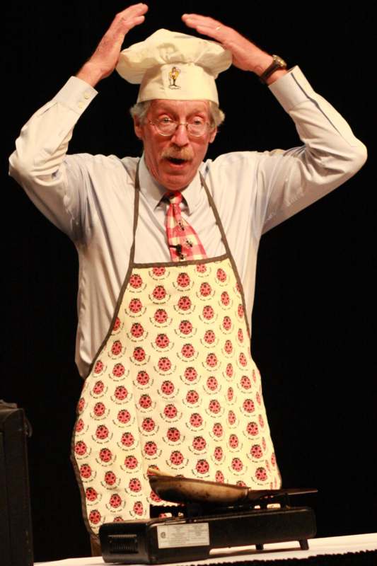 a man wearing a chef's hat and apron