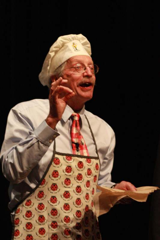 a man wearing a chef hat and apron