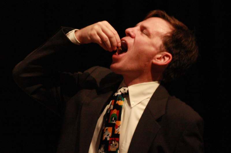 a man in a suit eating