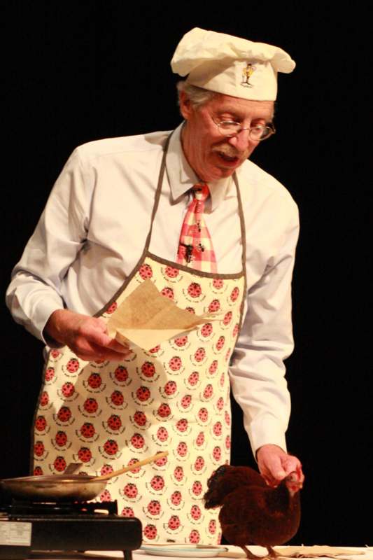 a man wearing an apron and tie