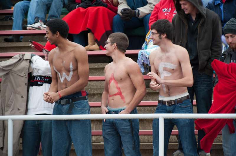 a group of men with no shirt