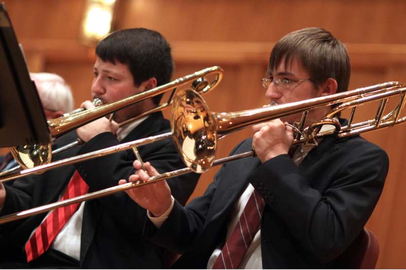 a group of men playing trumpets