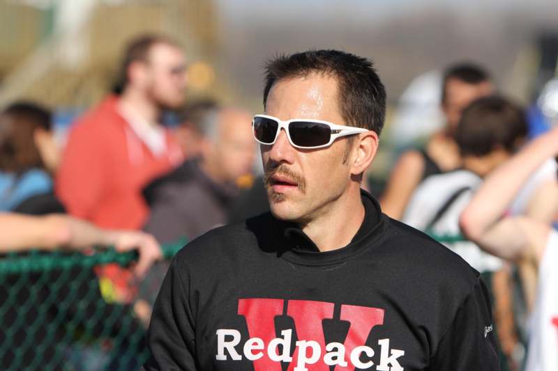 a man wearing sunglasses and a black shirt
