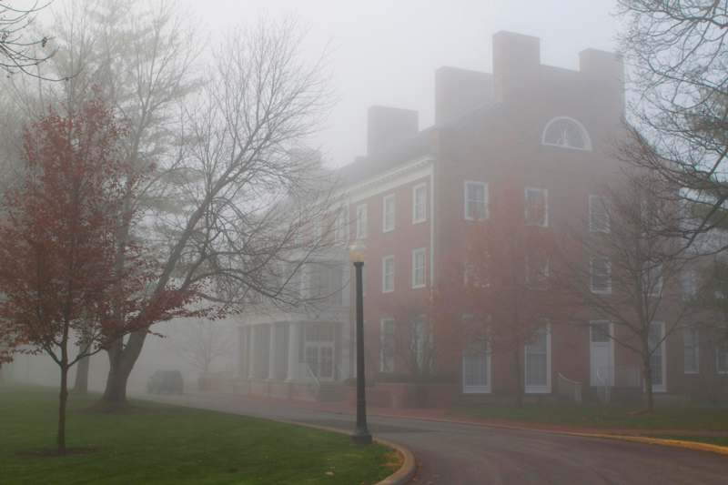 a building with fog in the background
