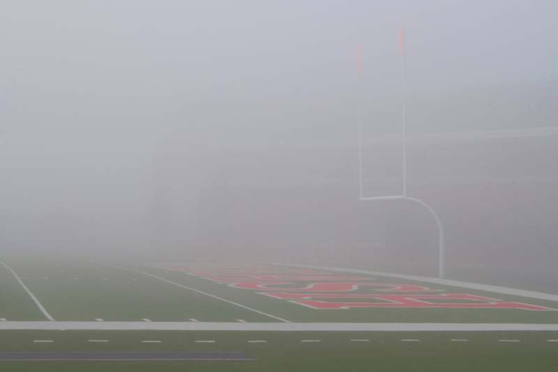 a football field with a foggy background