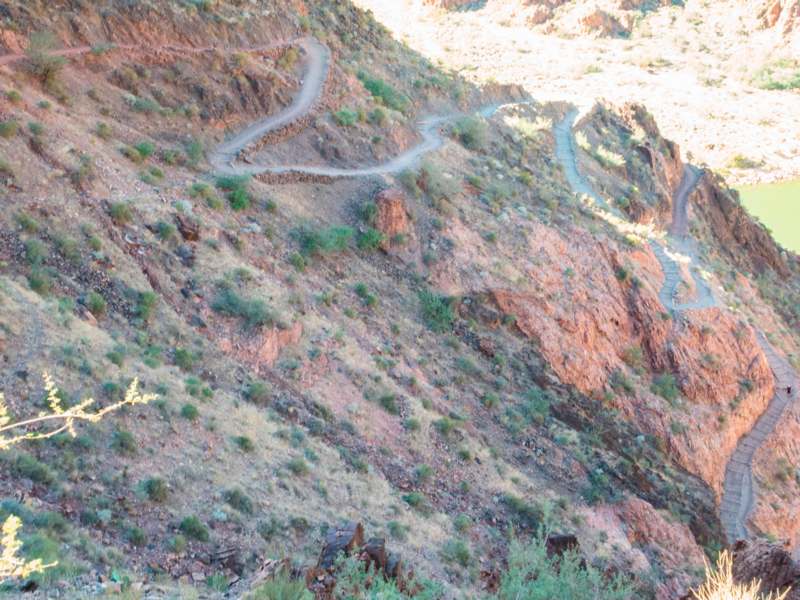 a winding road on a rocky hillside