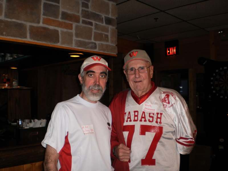 two men wearing matching jerseys