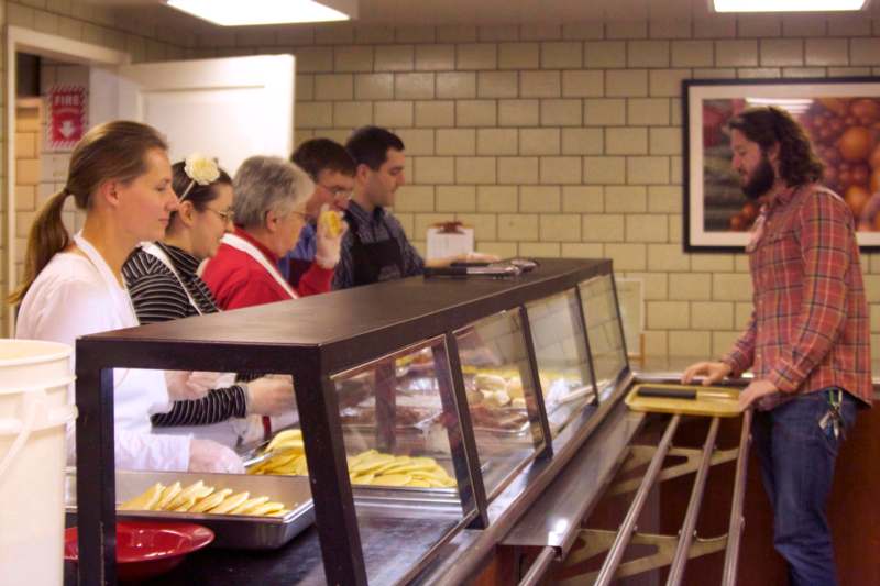 a group of people in a cafeteria