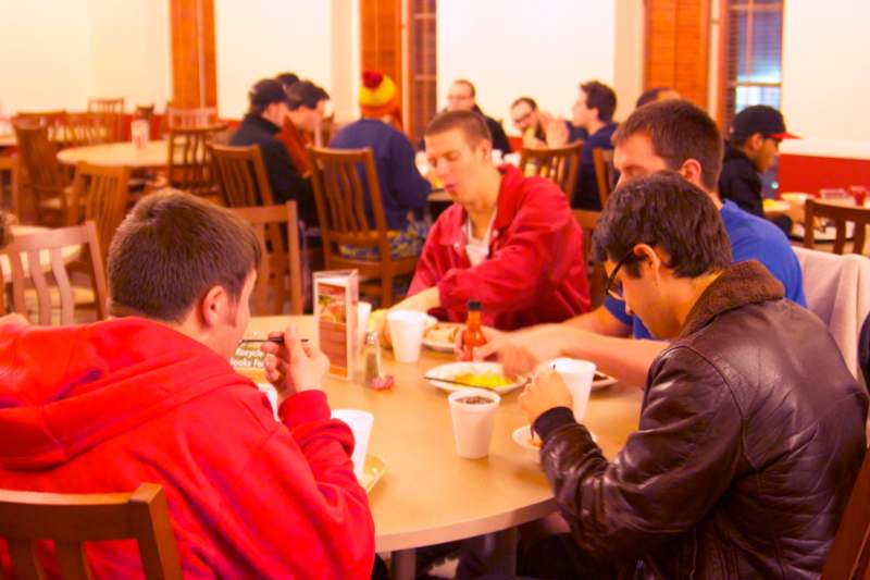 a group of people eating at a table