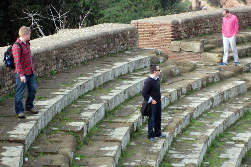 a man standing on a stone steps