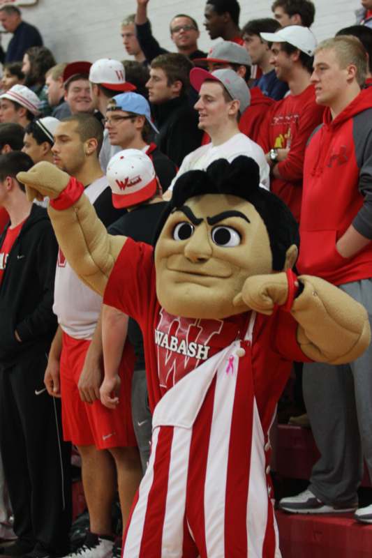 a person in a mascot garment pointing at something