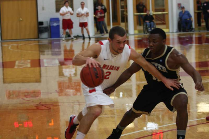 a basketball player chasing a basketball