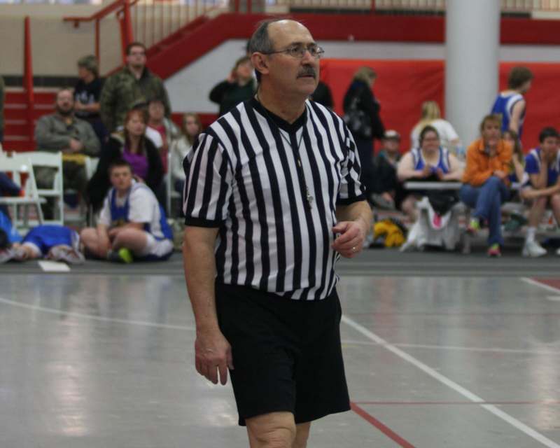 a man in a referee shirt