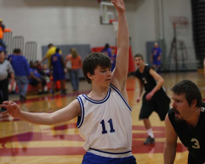 a boy in a basketball uniform