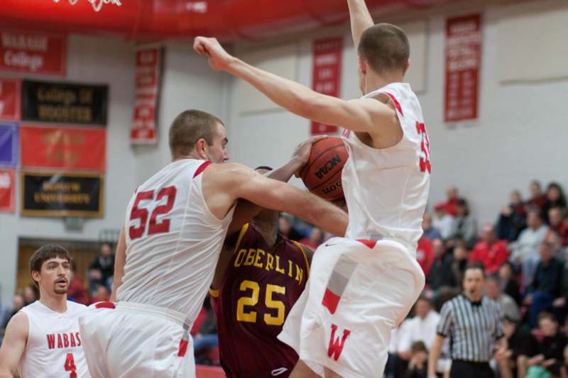 a group of men playing basketball