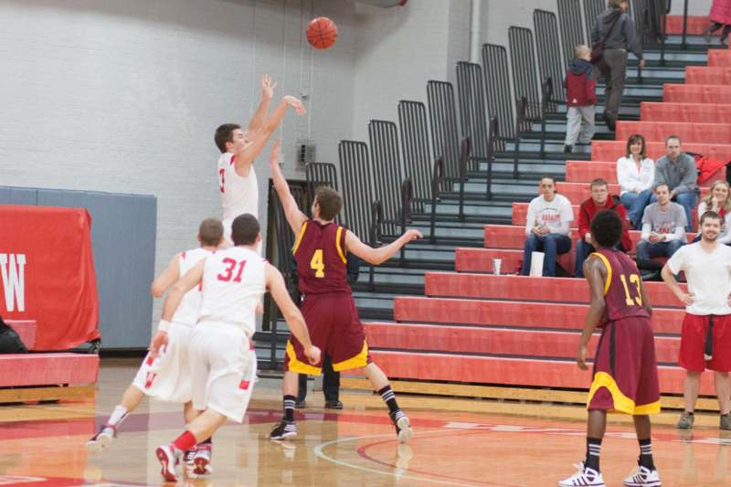 a group of people playing basketball