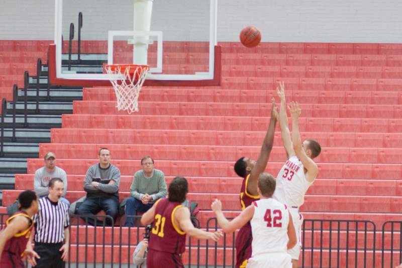 a group of people playing basketball