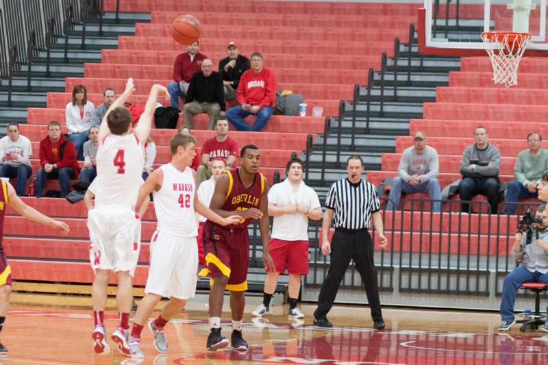 a group of men playing basketball