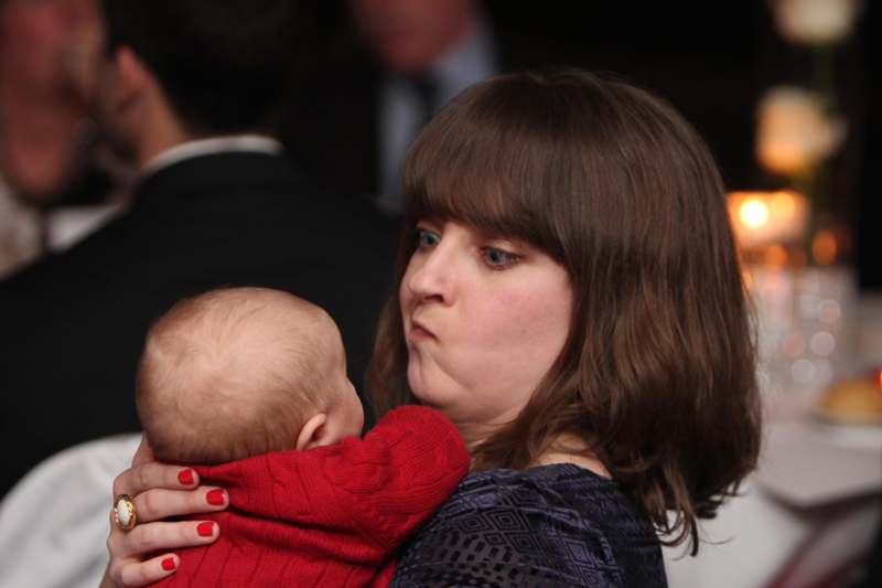 a woman holding a baby