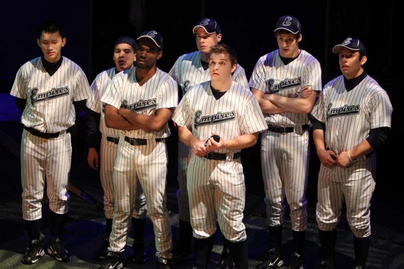a group of men in baseball uniforms