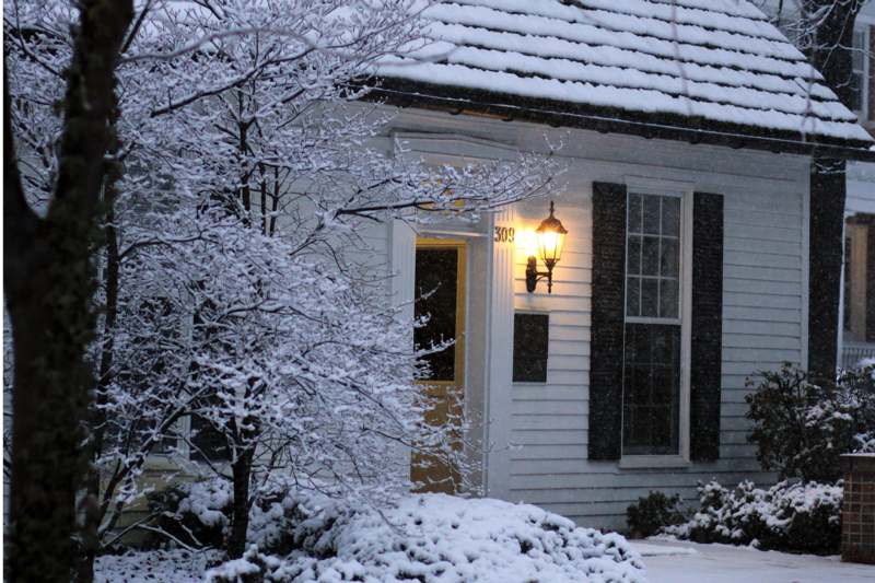 a house with snow on the ground