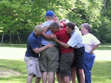 a group of people hugging each other