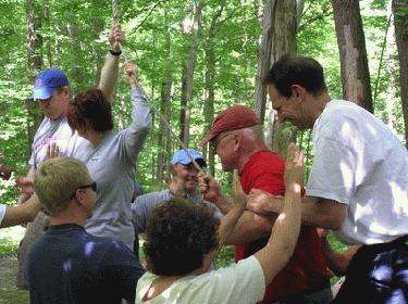 a group of people in a forest