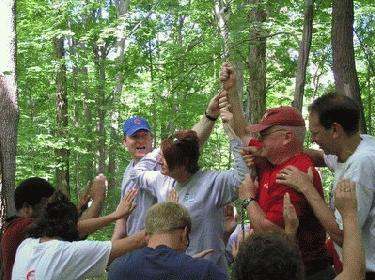a group of people celebrating in the woods