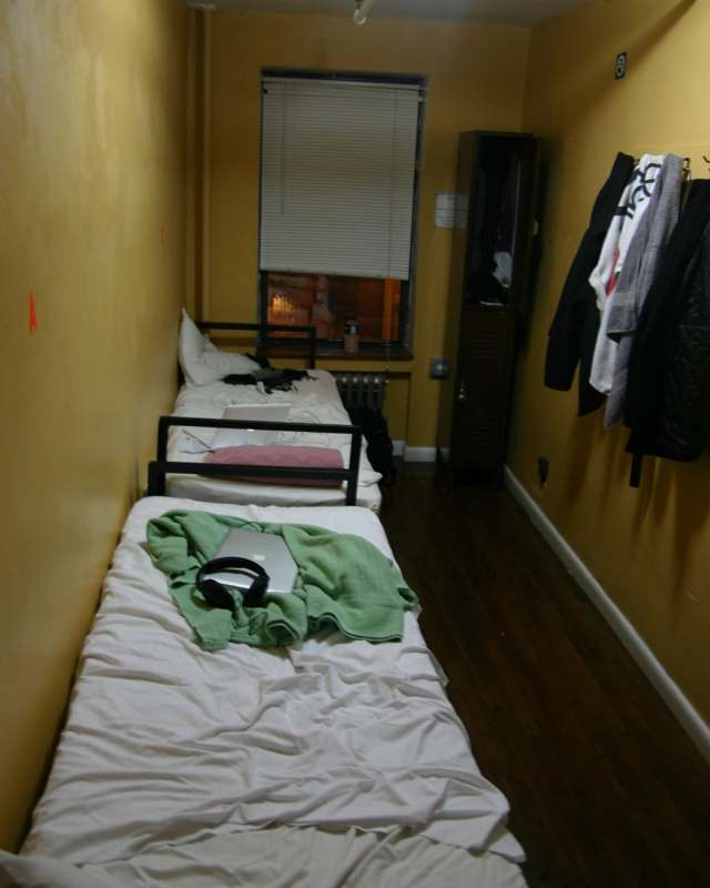 a small room with two beds