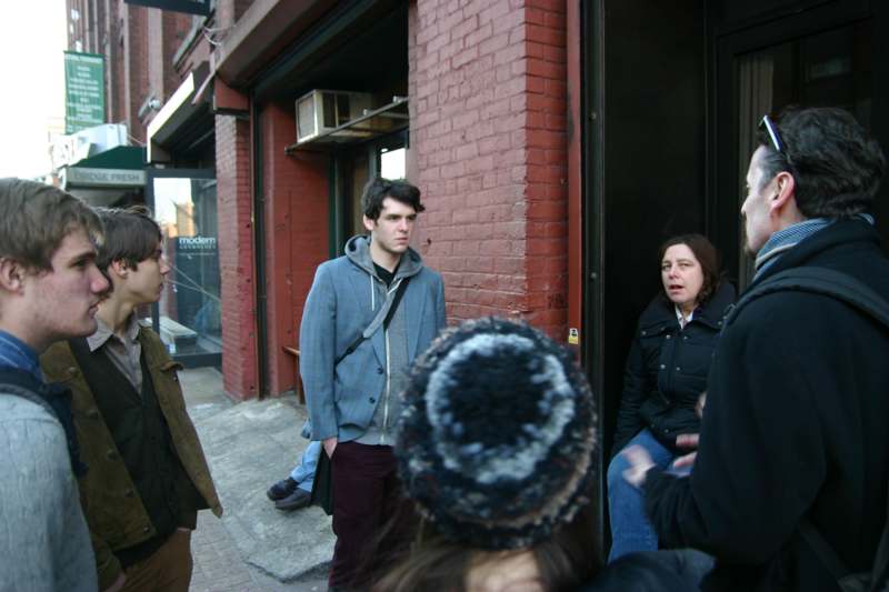 a group of people standing outside a building