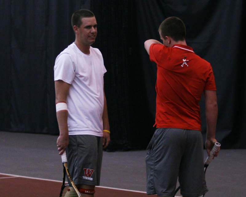 two men on a tennis court