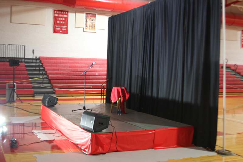 a stage with a microphone and speakers on it