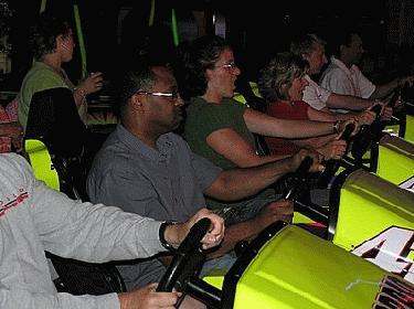 a group of people driving a bumper car