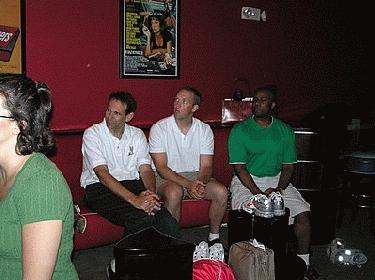 a group of men sitting on a couch