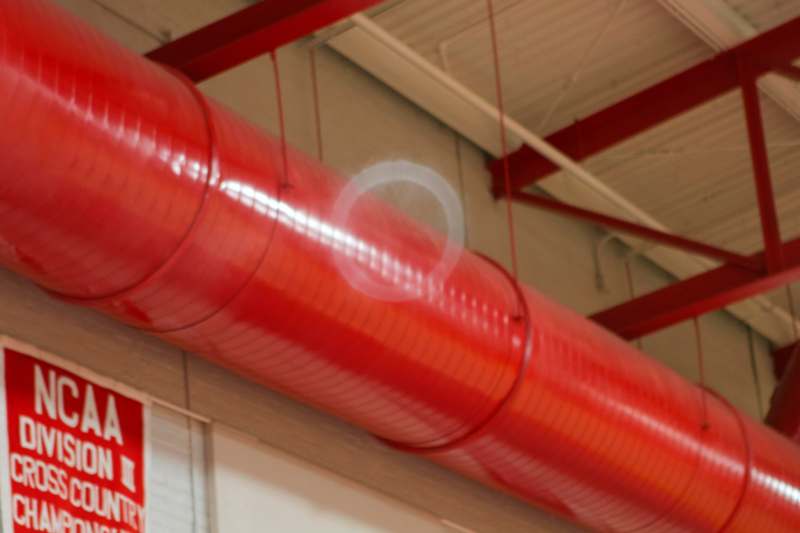 a large red tube with a white circle in the middle