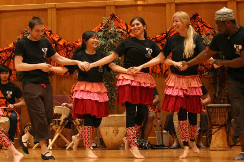 a group of women dancing on a stage
