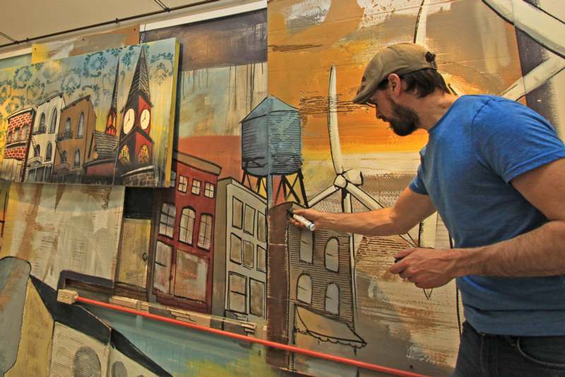 a man painting a mural