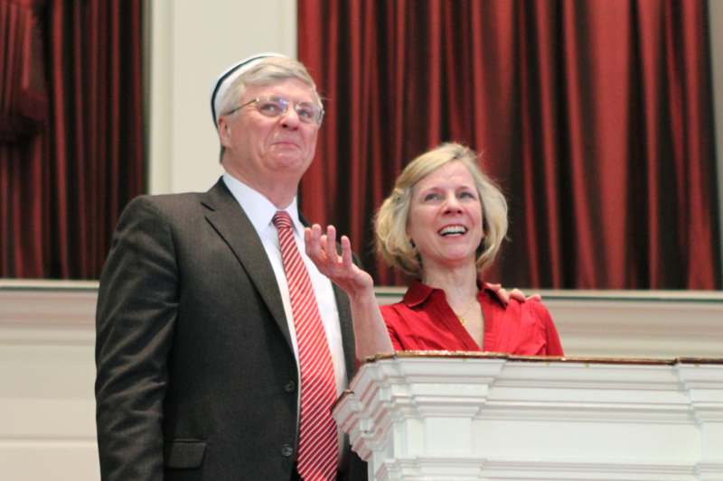 a man and woman standing at a podium