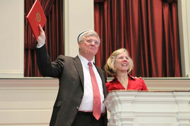 a man and woman standing at a podium