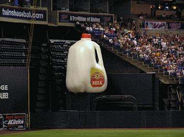 a large milk jug in a stadium
