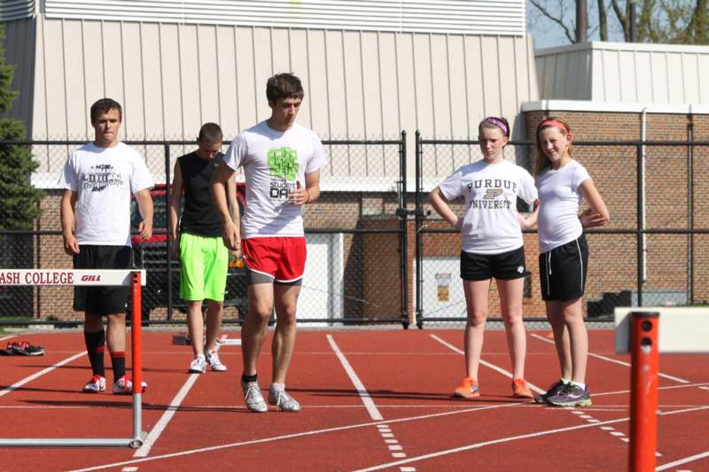 a group of people standing on a track