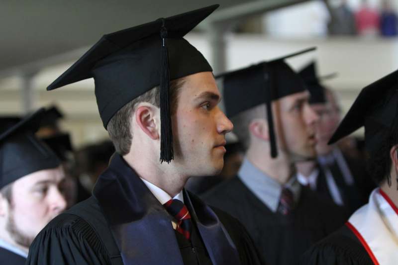 a man in a graduation cap and gown