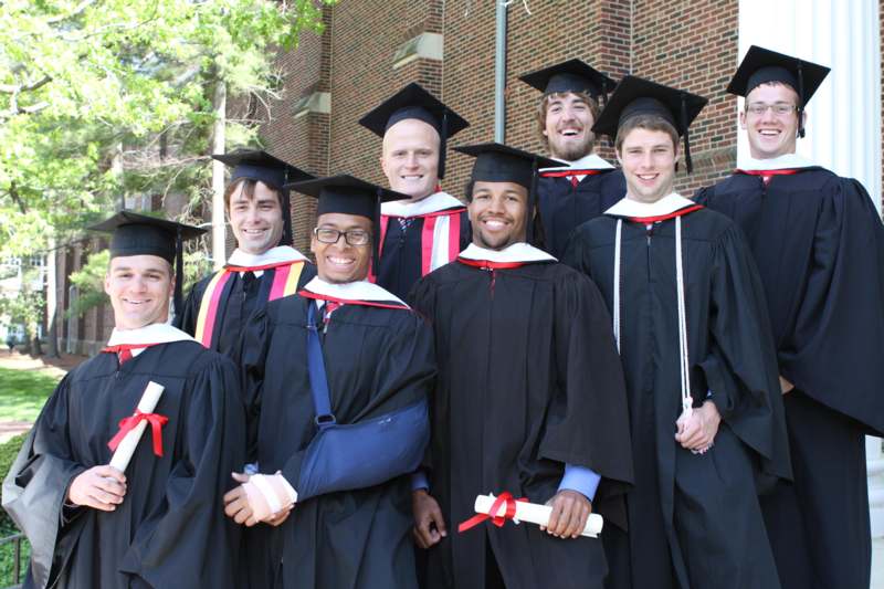 a group of graduates posing for a photo