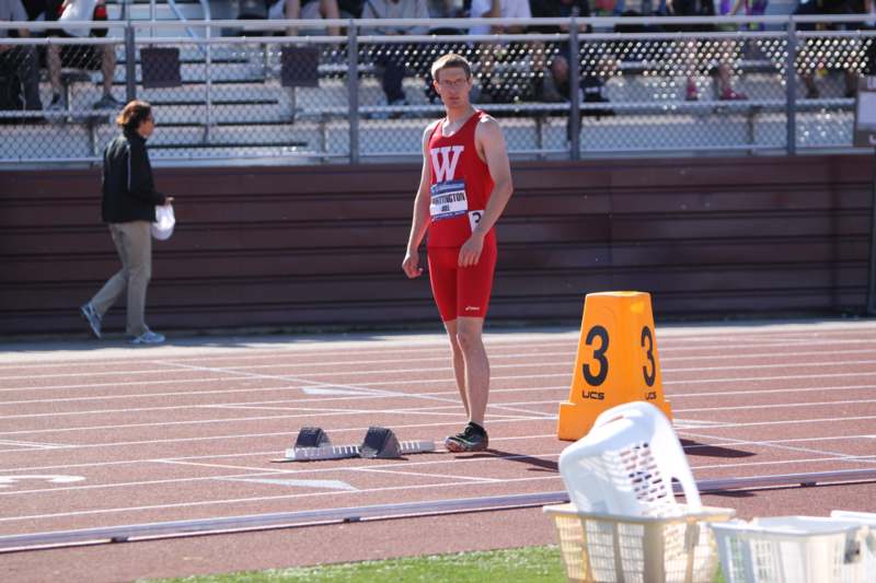 a man standing on a track