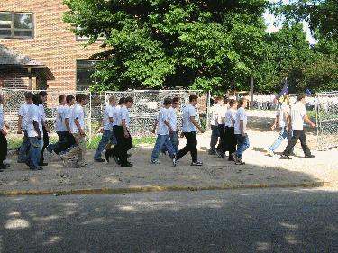 a group of people walking on the street