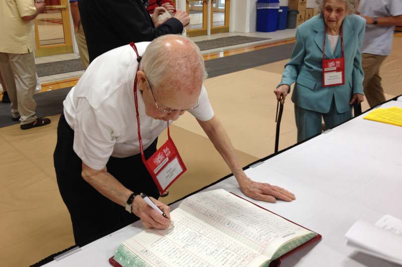 a man signing a book