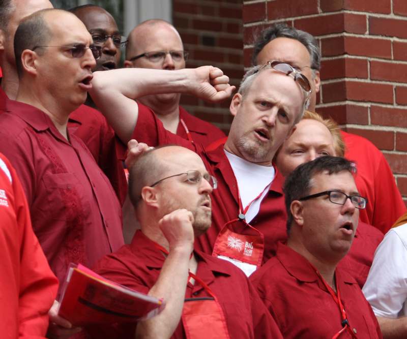 a group of people wearing red shirts